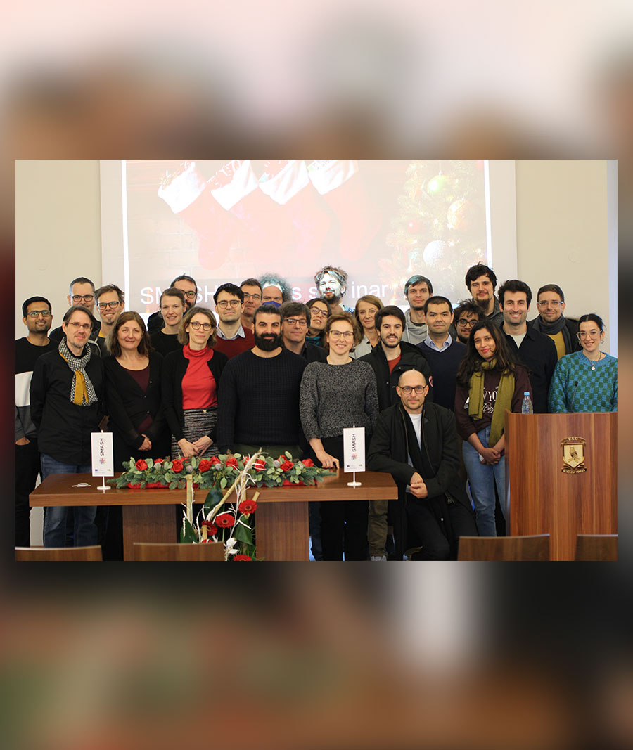Large group of people pose for a group photo at an event.